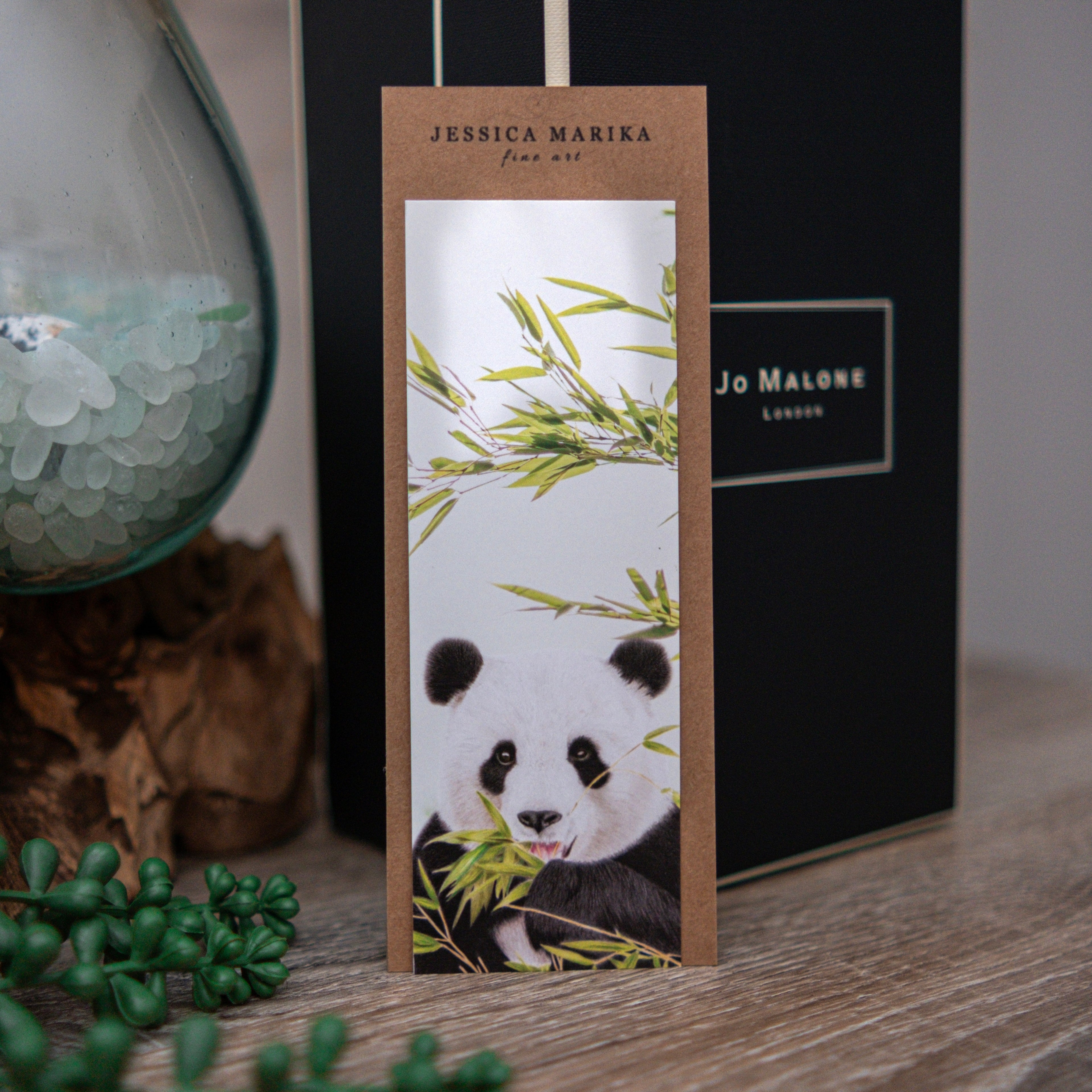 Bookmark with panda design on a wooden surface